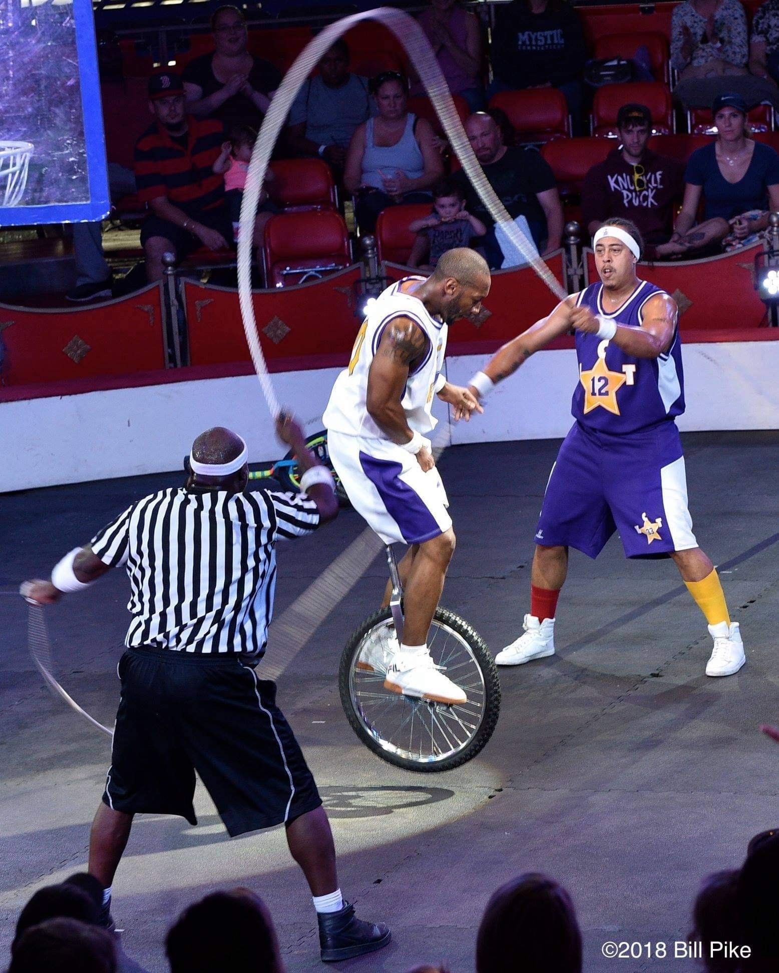 Kaseem Alamudeen performing a rope and basketball trick on a unicycle